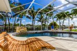 Sunset Point tropical pool with lounge options and water feature